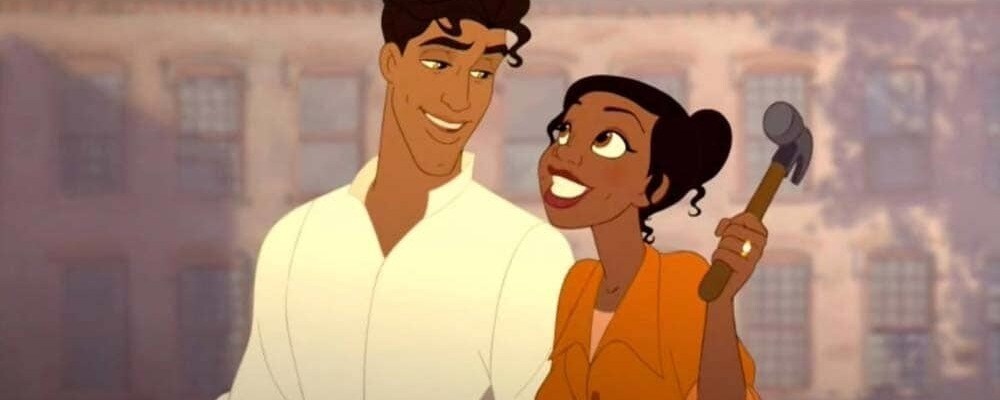 Prince Naveen and Tiana from The Princess and the Frog smile at each other while she holds a hammer.