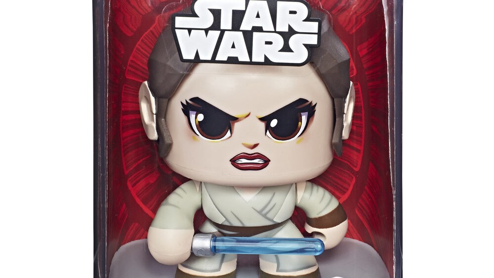 A Rey Mighty Muggs collectible figure with lightsaber in its packaging.