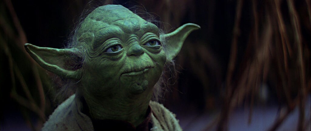 Yoda stands amid the swampy landscape of Dagobah in The Empire Strikes Back.
