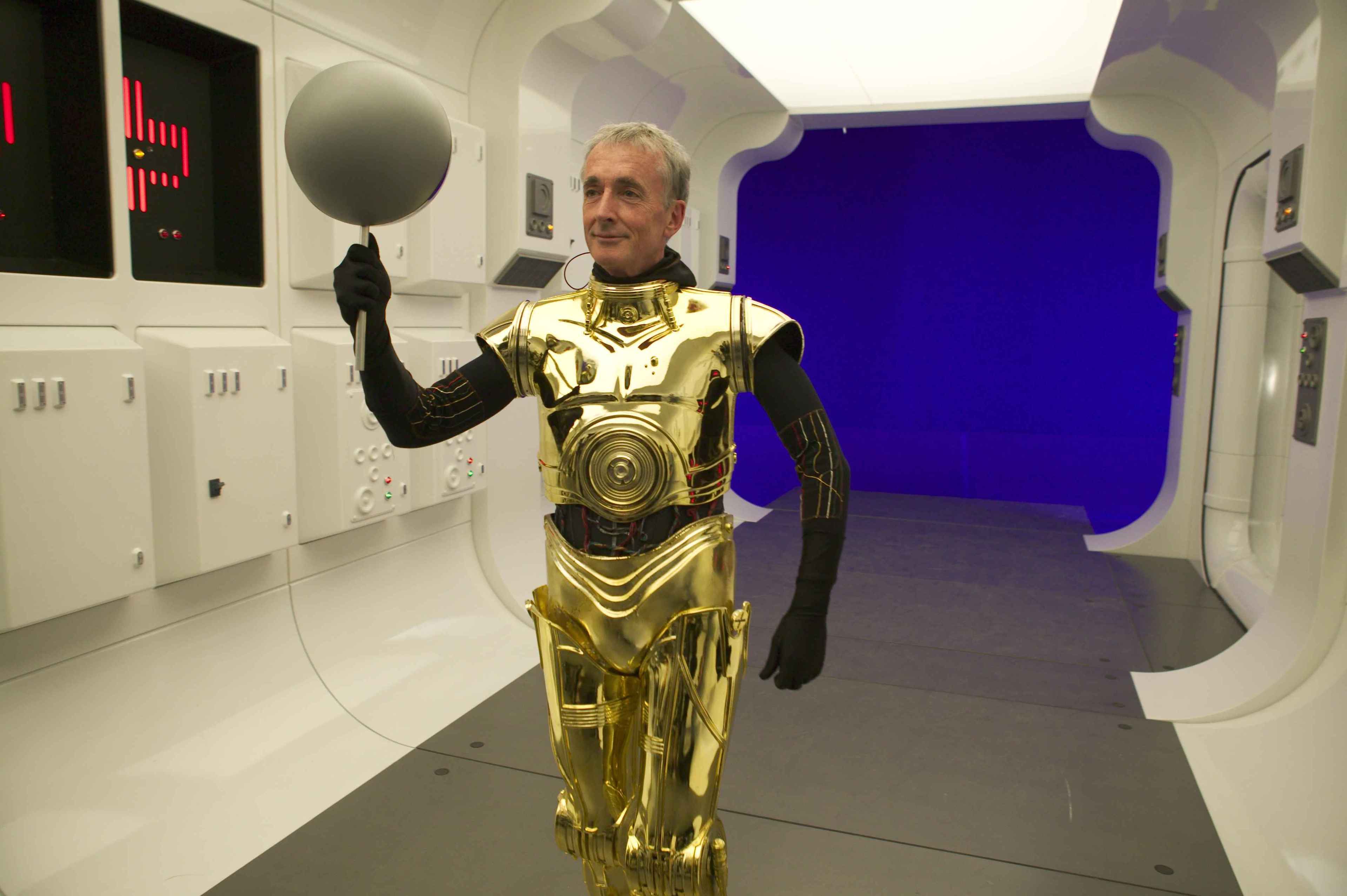 Anthony Daniels in-costume as C-3PO (now with his classic gold coverings).