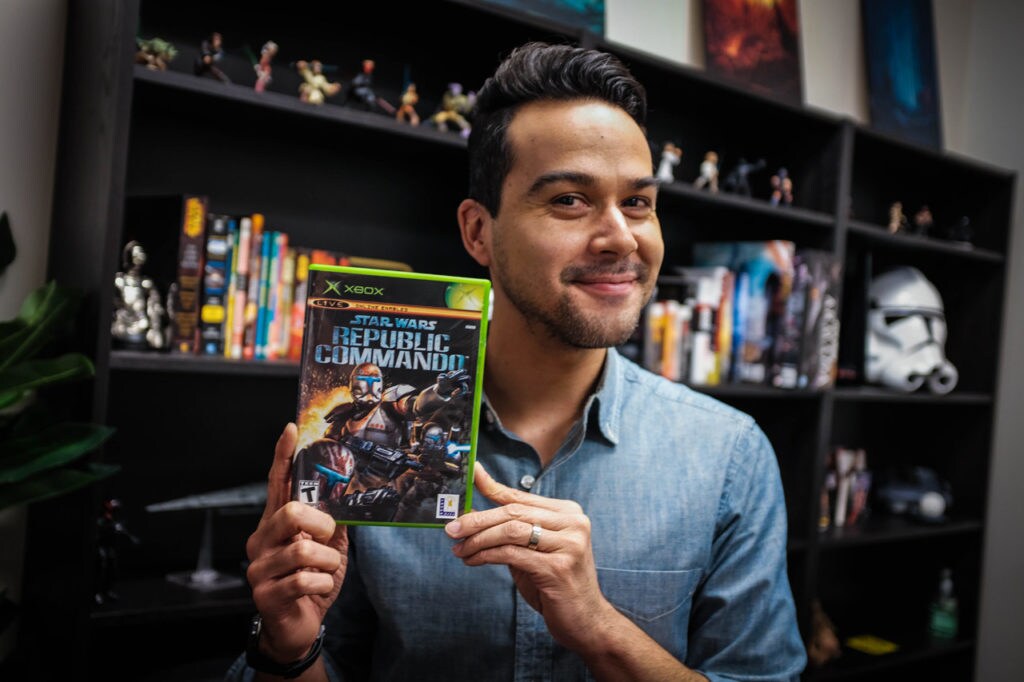 A member of the Lucasfilm Games Team holds up the box of Star Wars: Republic Commando.