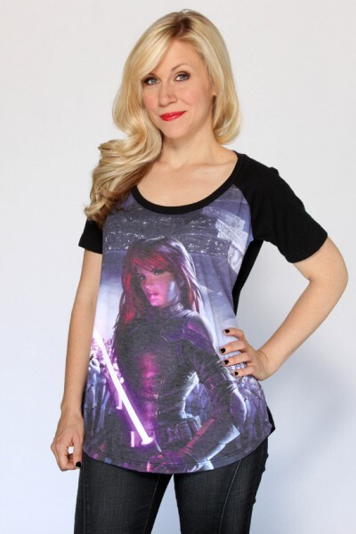 Voice actor and Her Universe founder Ashley Eckstein poses in a t-shirt depicting a lightsaber-wielding Mara Jade.