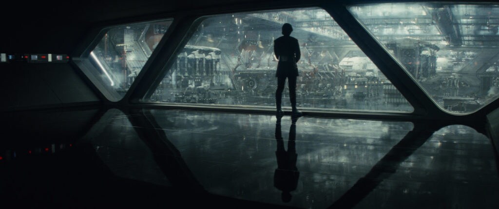 A silhouetted Kyle Ren stares out the window of a ship in Star Wars: The Last Jedi.