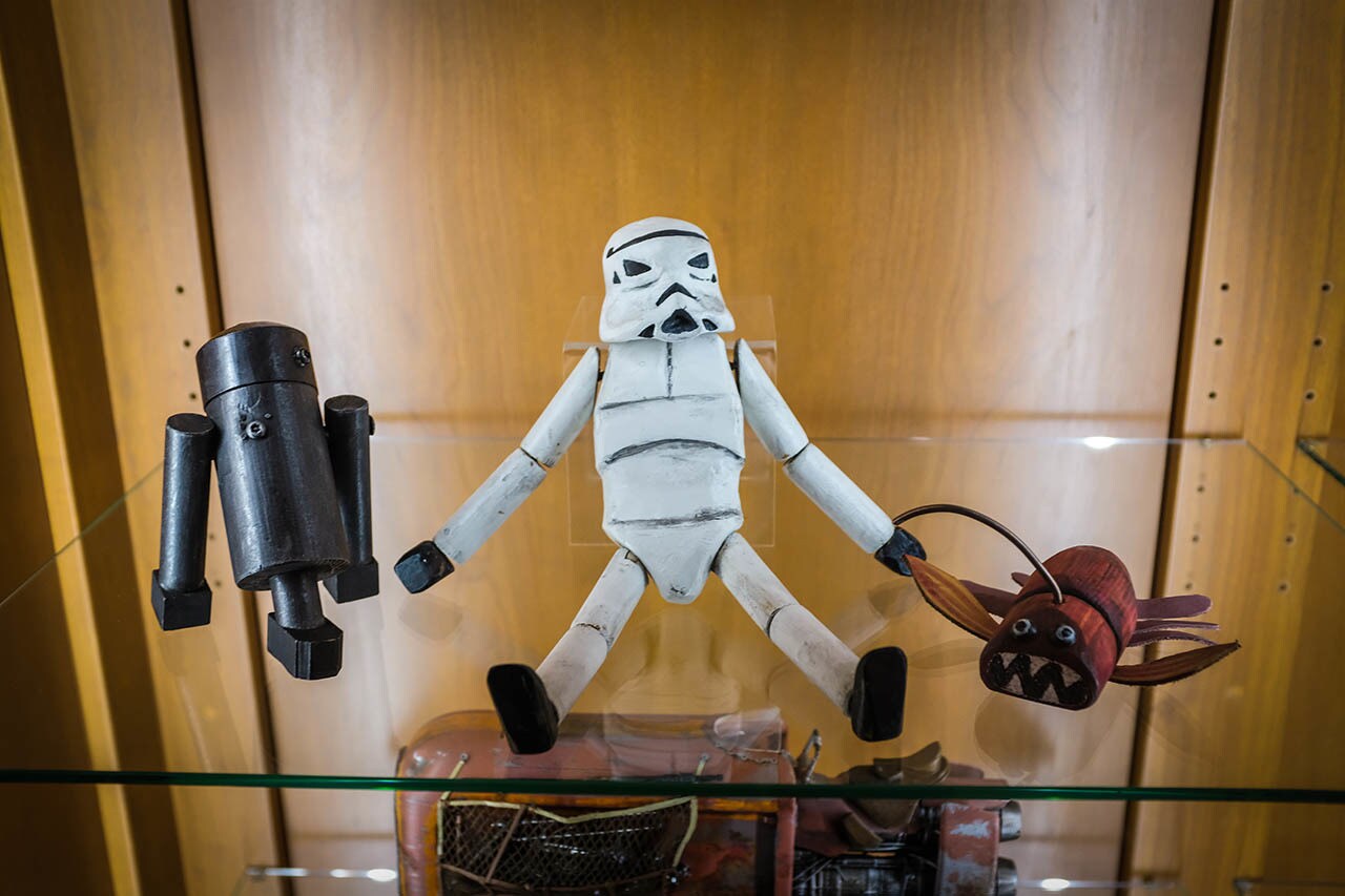 An assortment of toys are shown in the Lucasfilm display case.