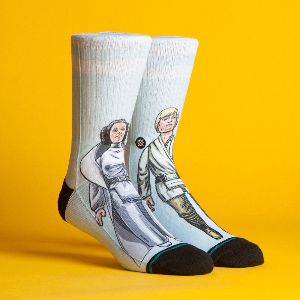 A pair of Star Wars-themed socks by California-based clothing brand Stance. One sock features Princess Leia while the other features Luke Skywalker.