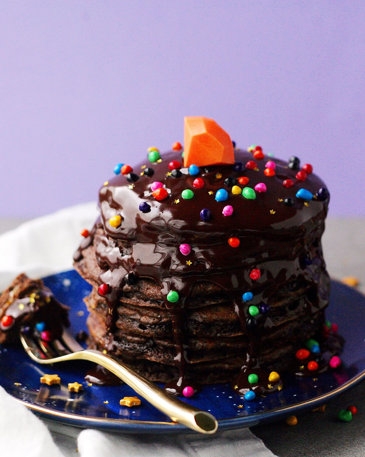 Chocolate pancakes inspired by Onward, topped with sprinkles and a chocolate gem.
