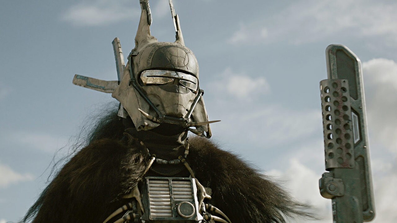 Enfys Nest stands in her mask and furs in Solo: A Star Wars Story.