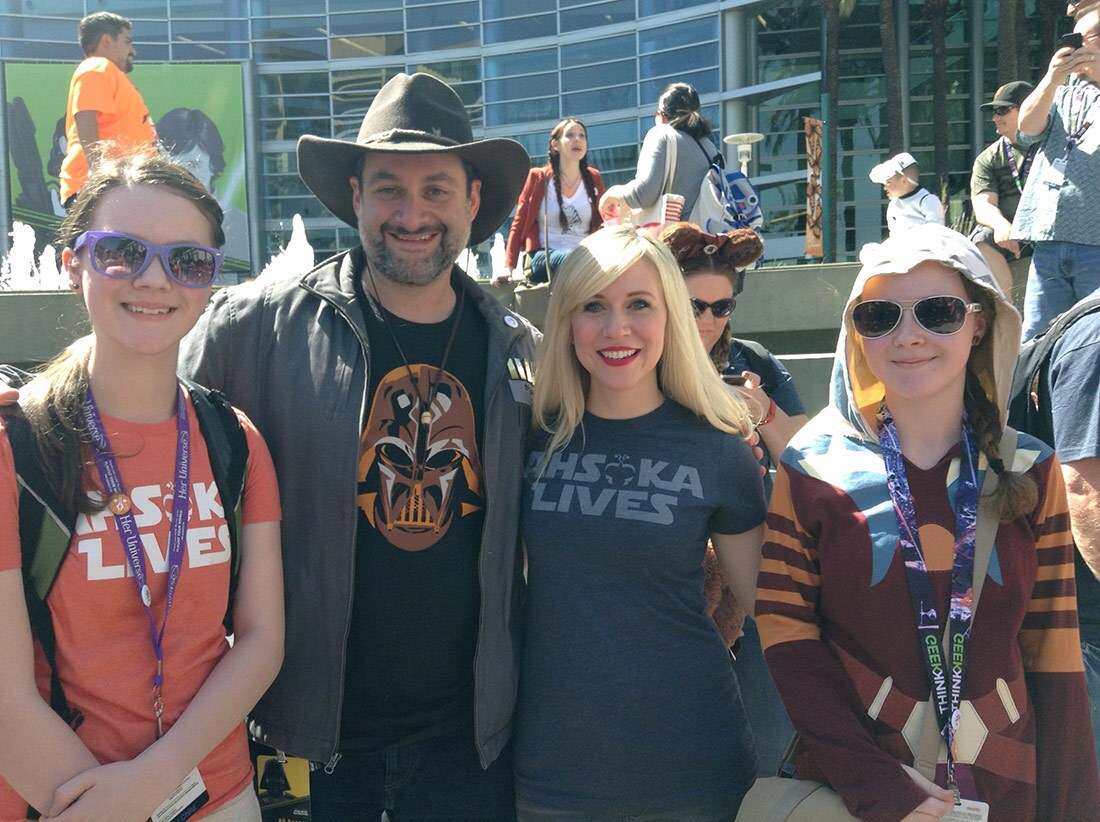 Fans pose with Star Wars writer-director Dave Filoni and voice actor Ashley Eckstein at Star Wars Celebration Orlando.