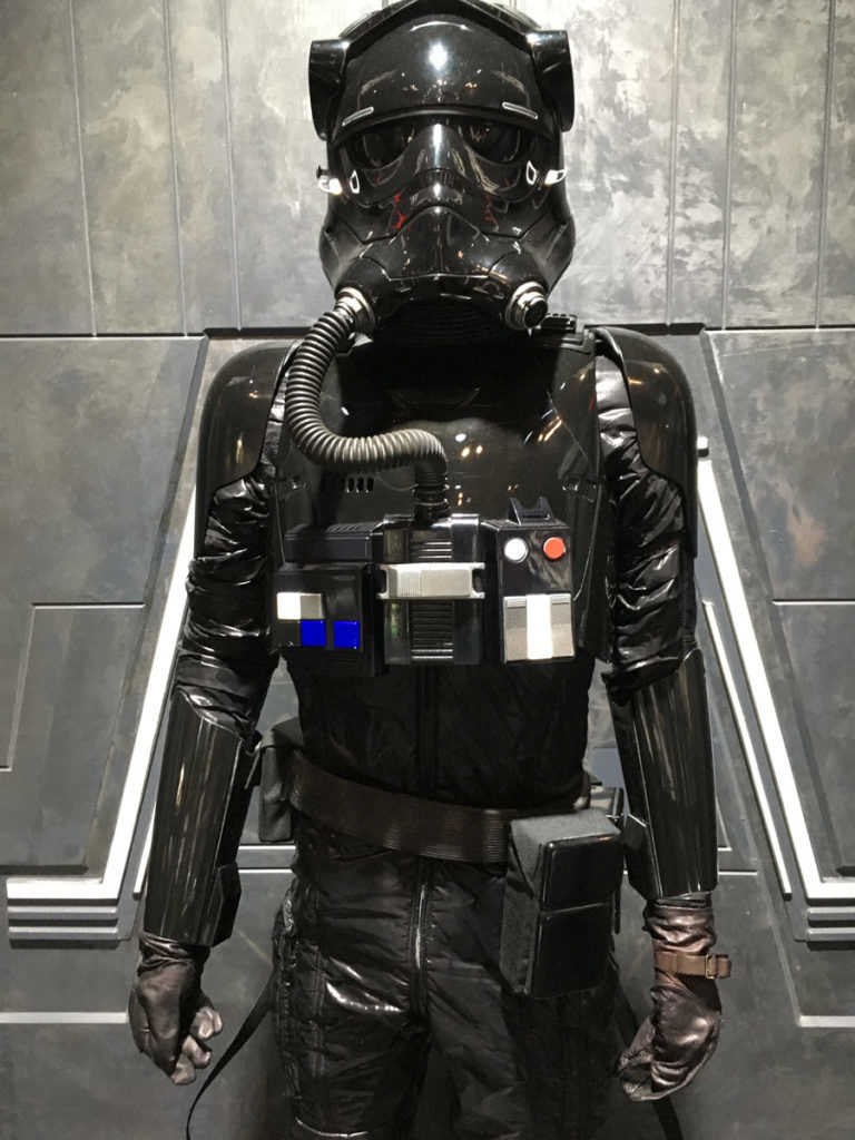 A First Order TIE fighter pilot uniform on display at the Star Wars: The Last Jedi Prop Gallery.