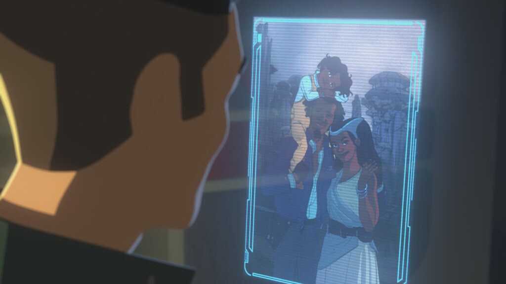 Kaz looks at a holo of Yeager's family on Batuu.