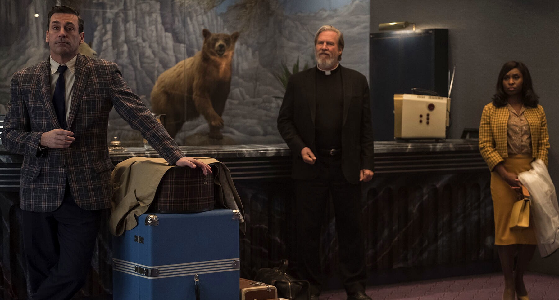 Actors John Hamm (as Laramie Seymour Sullivan), Jeff Bridges (as Father Daniel Flynn), and Cynthia Erivo (as Darlene Sweet) in the movie " Bad Times At The El Royale"