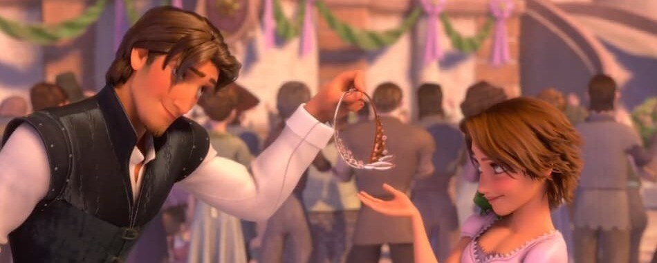 Flynn Rider hands Rapunzel a crown.