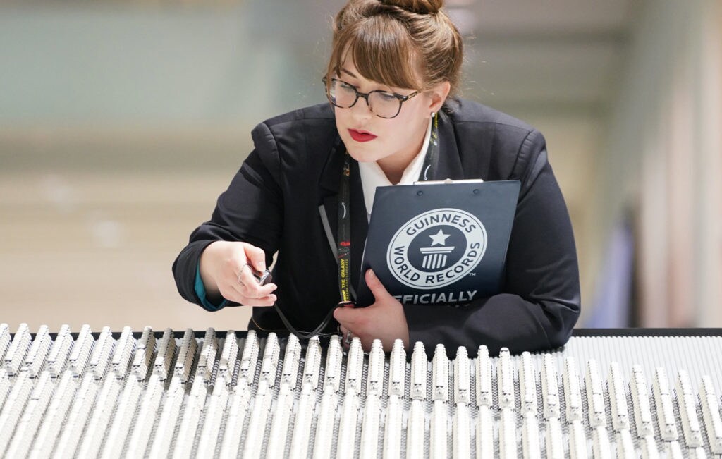 GUINNESS WORLD RECORDS Adjudicator, Christina Flounders Colon, counts stormtrooper minifigures in assessment of the LEGO Group’s attempt to break the record for largest display of LEGO Star Wars minifigures at Star Wars Celebration at McCormick Place in Chicago, April 11, 2019. (Alex Garcia/AP Images for The LEGO Group)