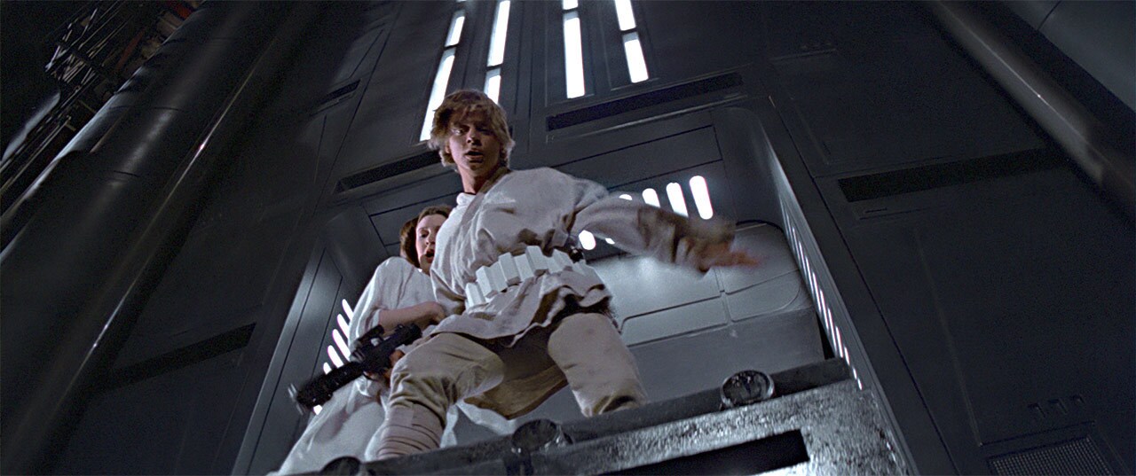 Leia clings to Luke as they nearly fall down a shaft on the Death Star in A New Hope.