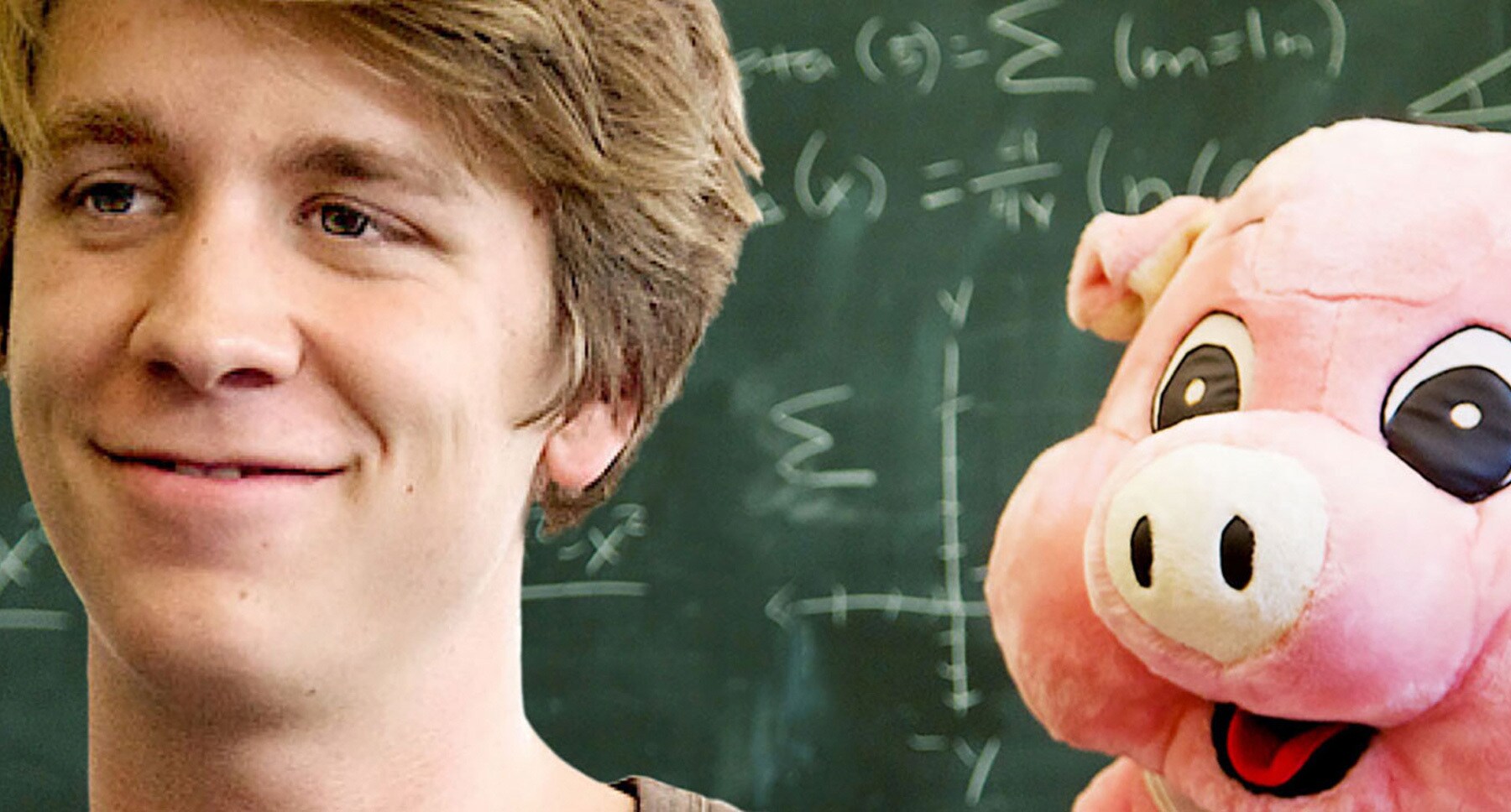 Thomas Mann (as Greg) with a stuffed toy pig in "Me and Earl and the Dying Girl"