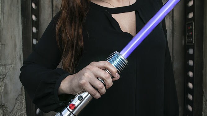 Lifestyle image of a lightsaber from DisneyParks