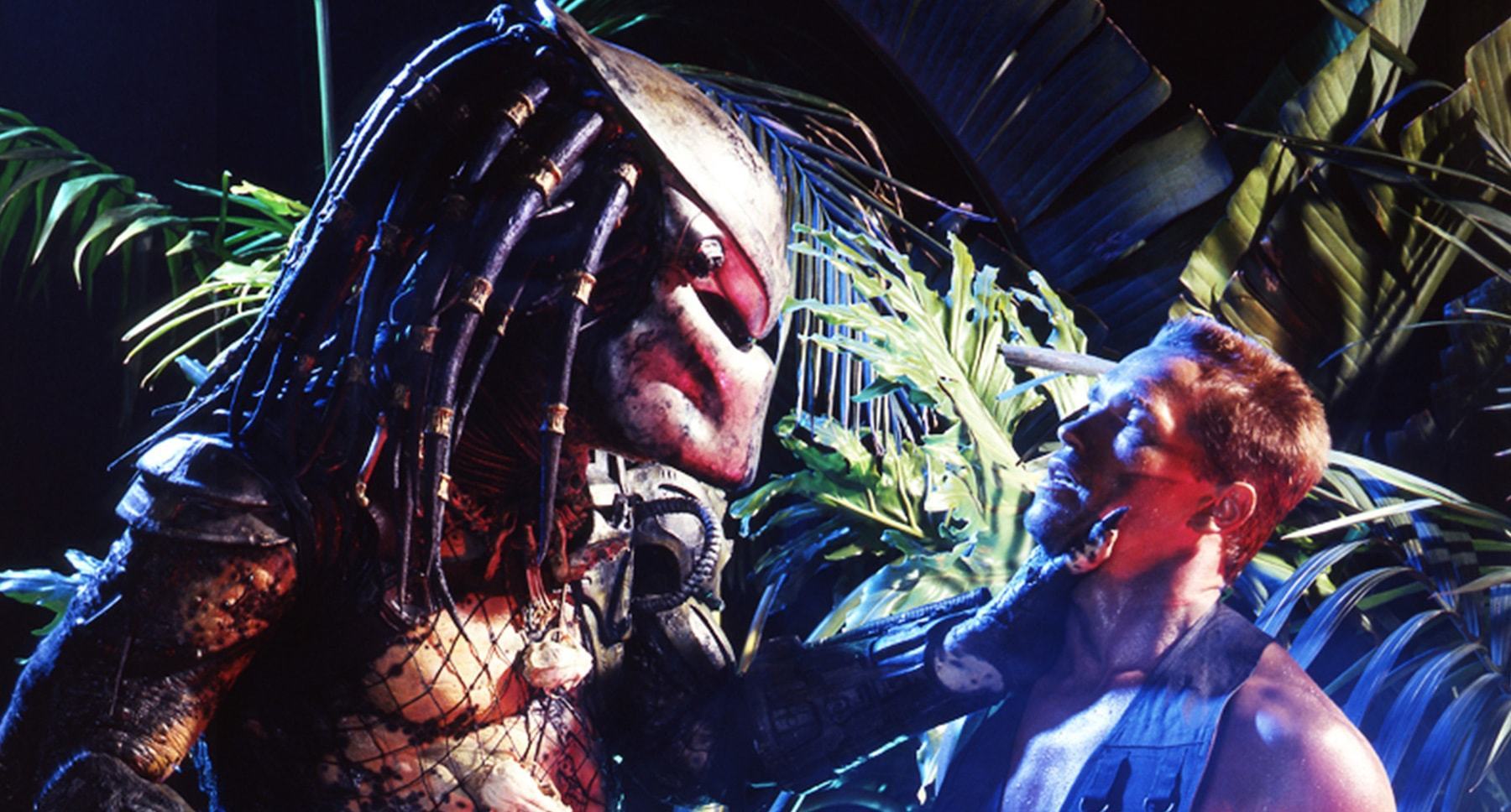 Arnold Schwarzenegger (as Dutch) and the Predator in the movie "Predator"