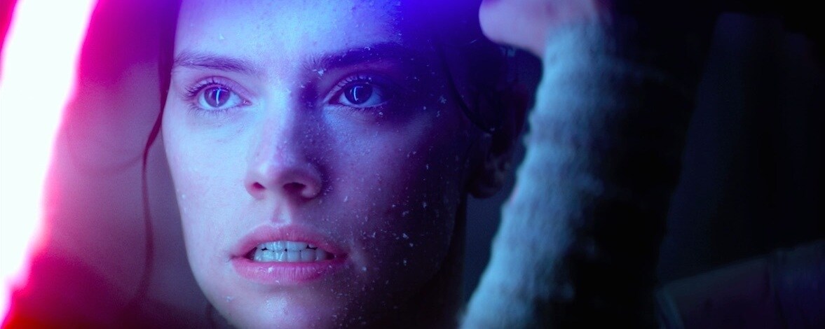 Rey blocks Kylo Ren's lightsaber, during a duel in The Force Awakens.