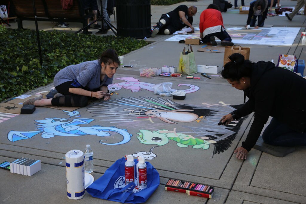 Lucasfilm and Industrial Light & Magic employees draw porgs and other cute creatures at The 6th Annual Lucasfilm Sidewalk Art Festival.