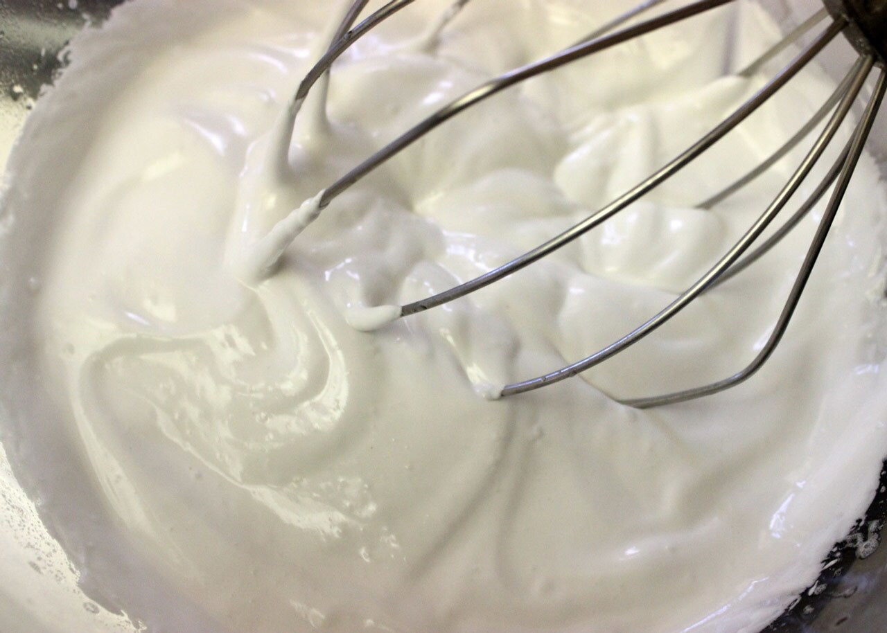 A whisk whips up a gelatin mixture.