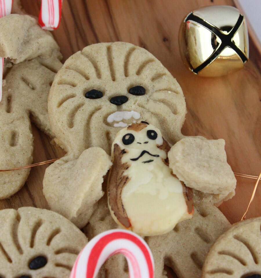 A Holiday Hug Wookiee Cookie holds a pie porg between its arms.