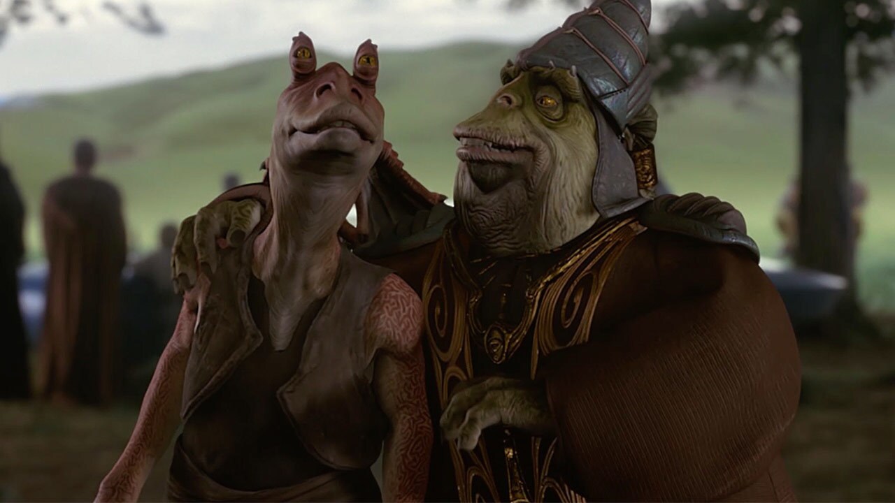 Boss Nass puts his arm around Jar Jar Binks in the forest on Naboo in The Phantom Menace.