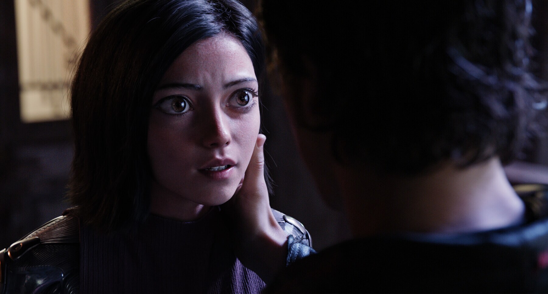 Rosa Salazar talking to a character in the movie Alita: Battle Angel