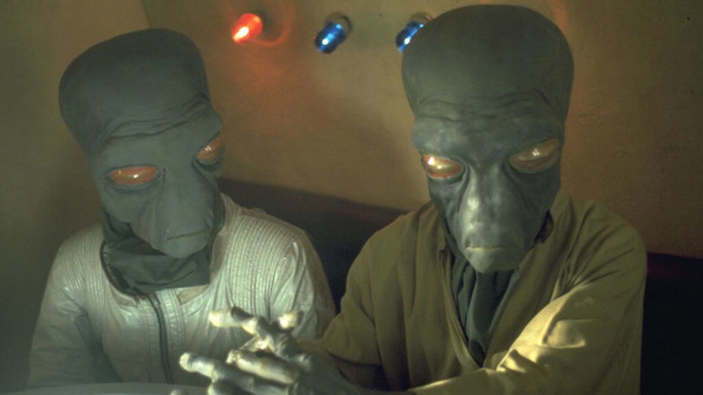 Two large-eyed Duros aliens, in A New Hope's cantina sequence.