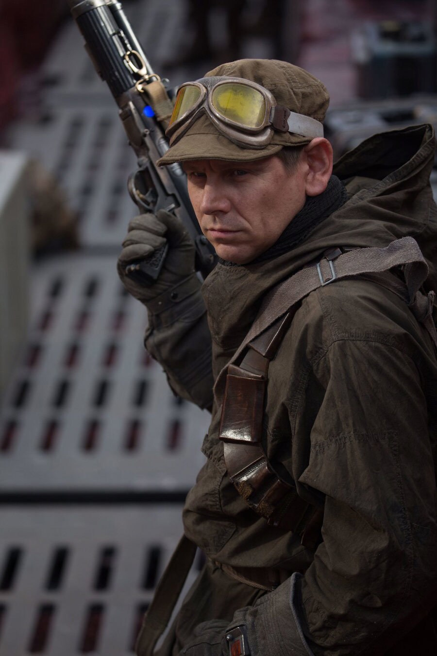 Puppeteer and actor Brian Herring brandishes a blaster pistol while playing a Resistance Soldier in The Last Jedi.