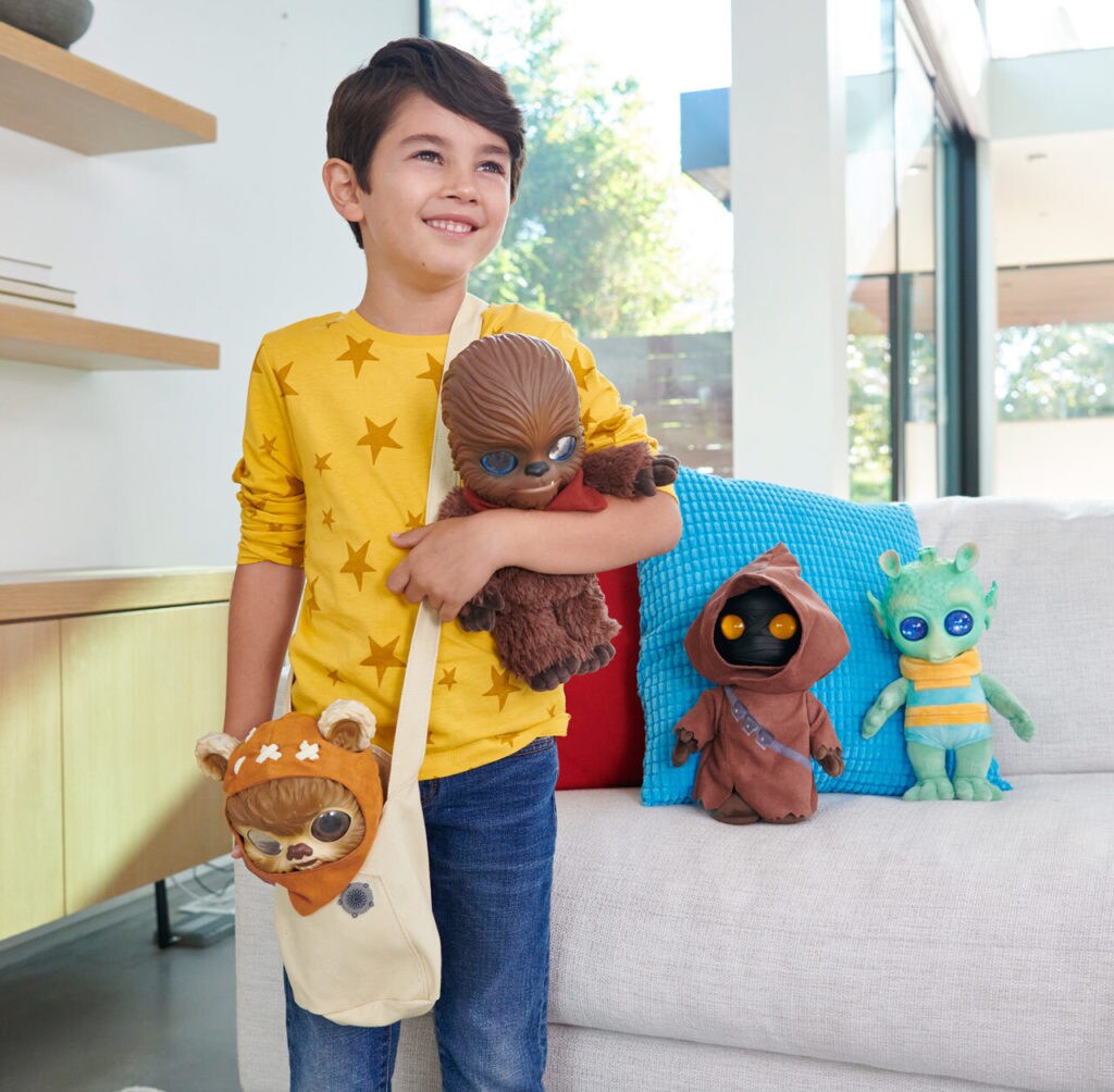 Star Wars Galactic Pals-inspired plushes being held.