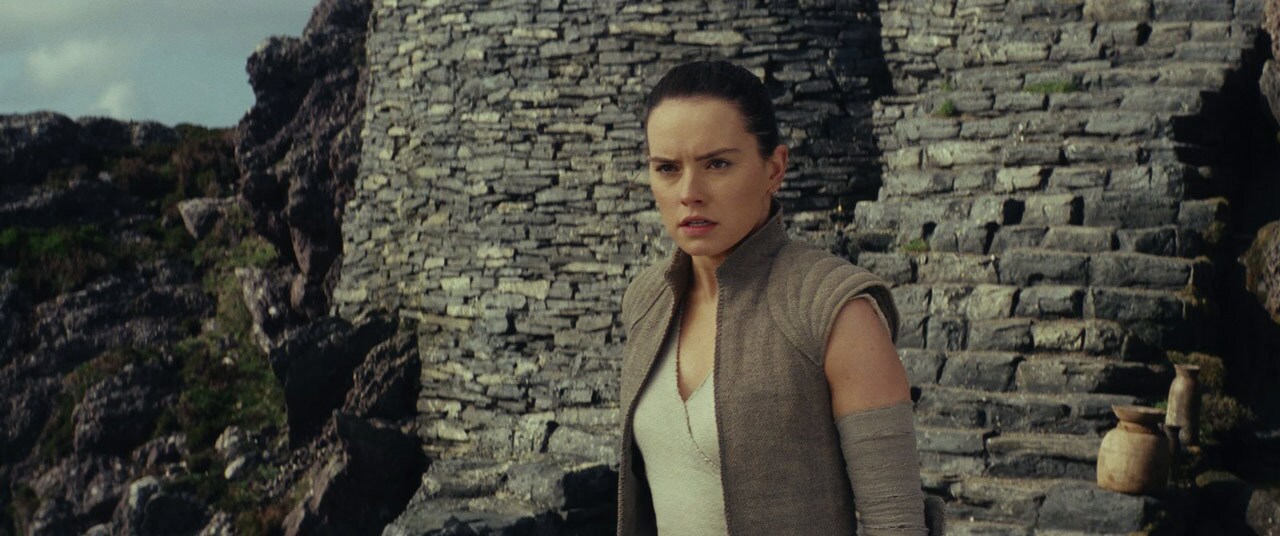 Rey in the stone temple compound on Ahch-To.