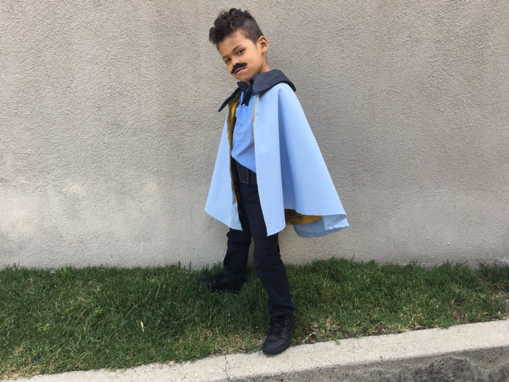 DIY Star Wars: The Last Jedi Halloween costume, child wears a cape.