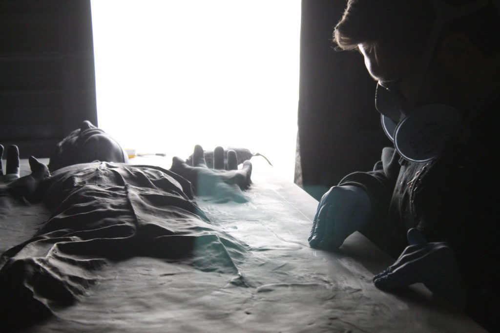 Sculptor Steve Richter works on the carbonite Han Solo desk.