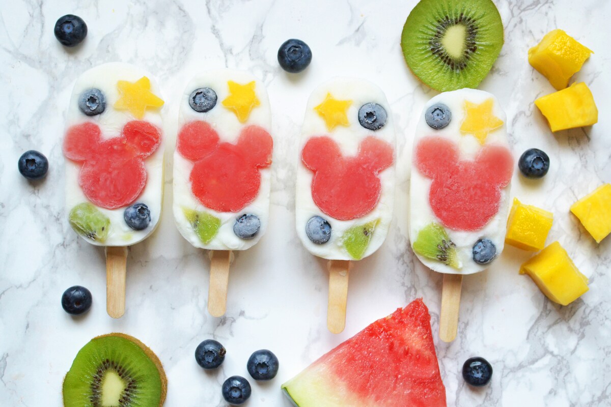 Fruit popsicles with Mickey Mouse in the center.