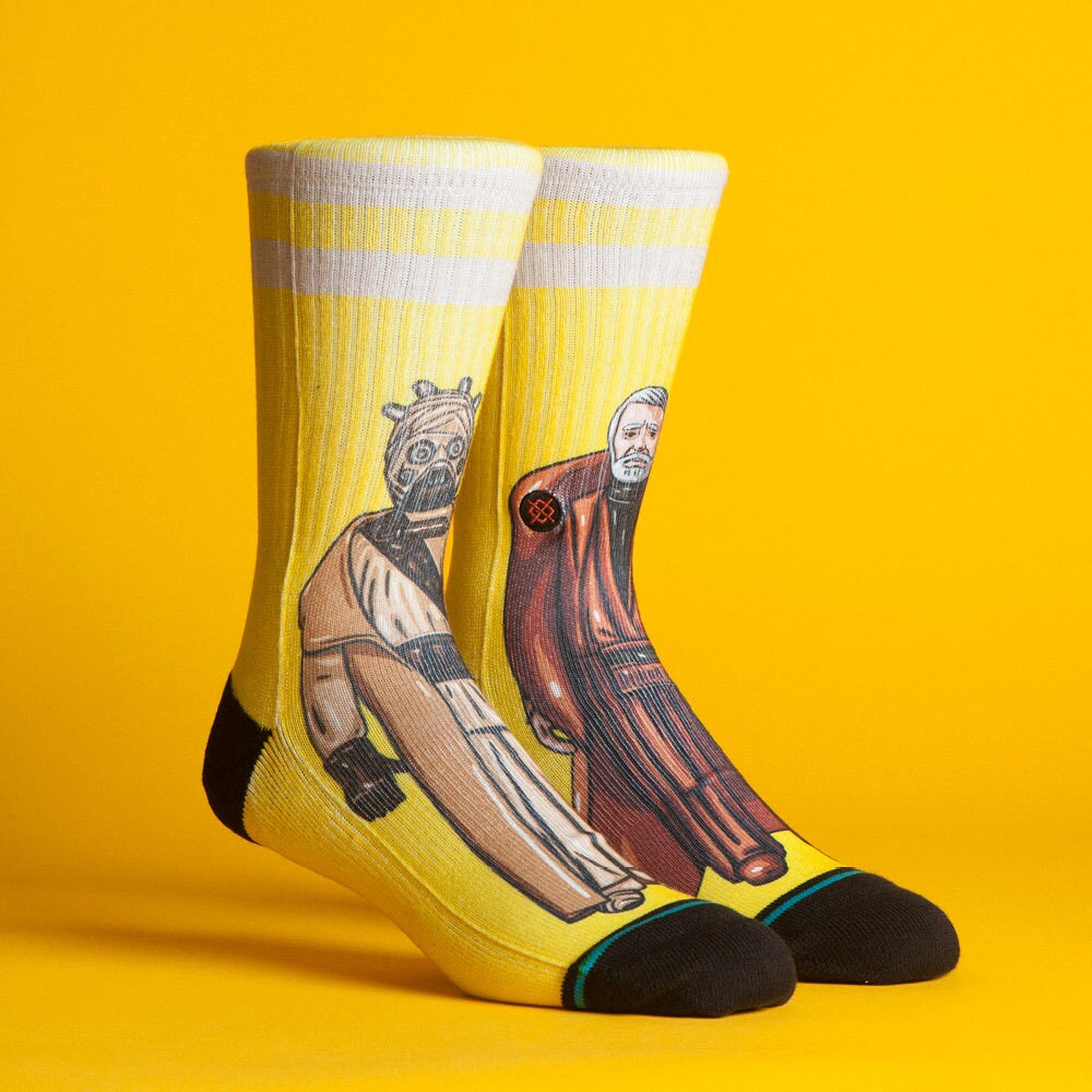 A pair of Star Wars-themed socks by California-based clothing brand Stance. One sock features a Tusken Raider while the other features Obi-Wan Kenobi.