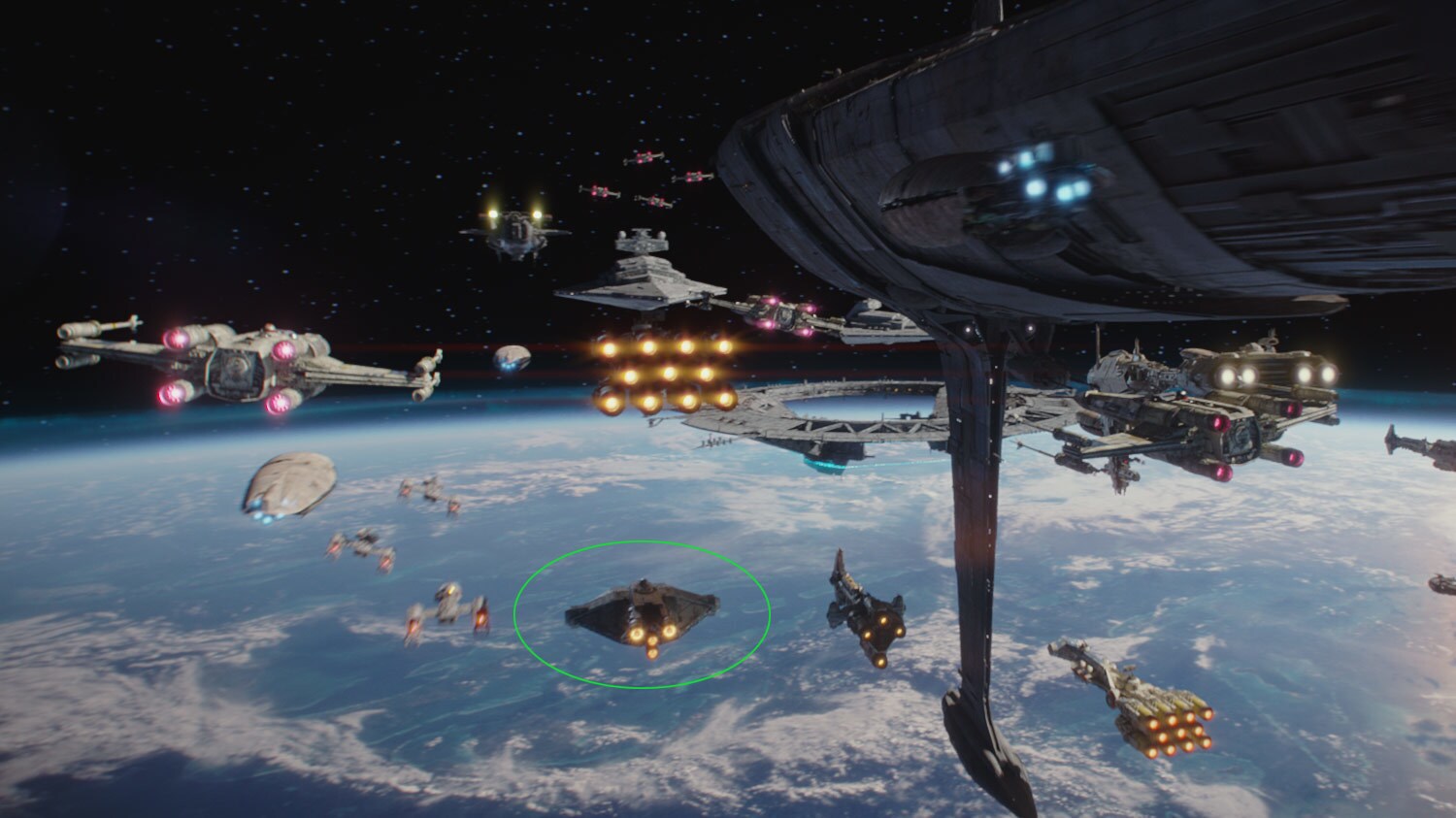 Rebel ships face off against a Star Destroyer in the Battle of Scarif. Ghost, from Star Wars Rebels, is circled in red.
