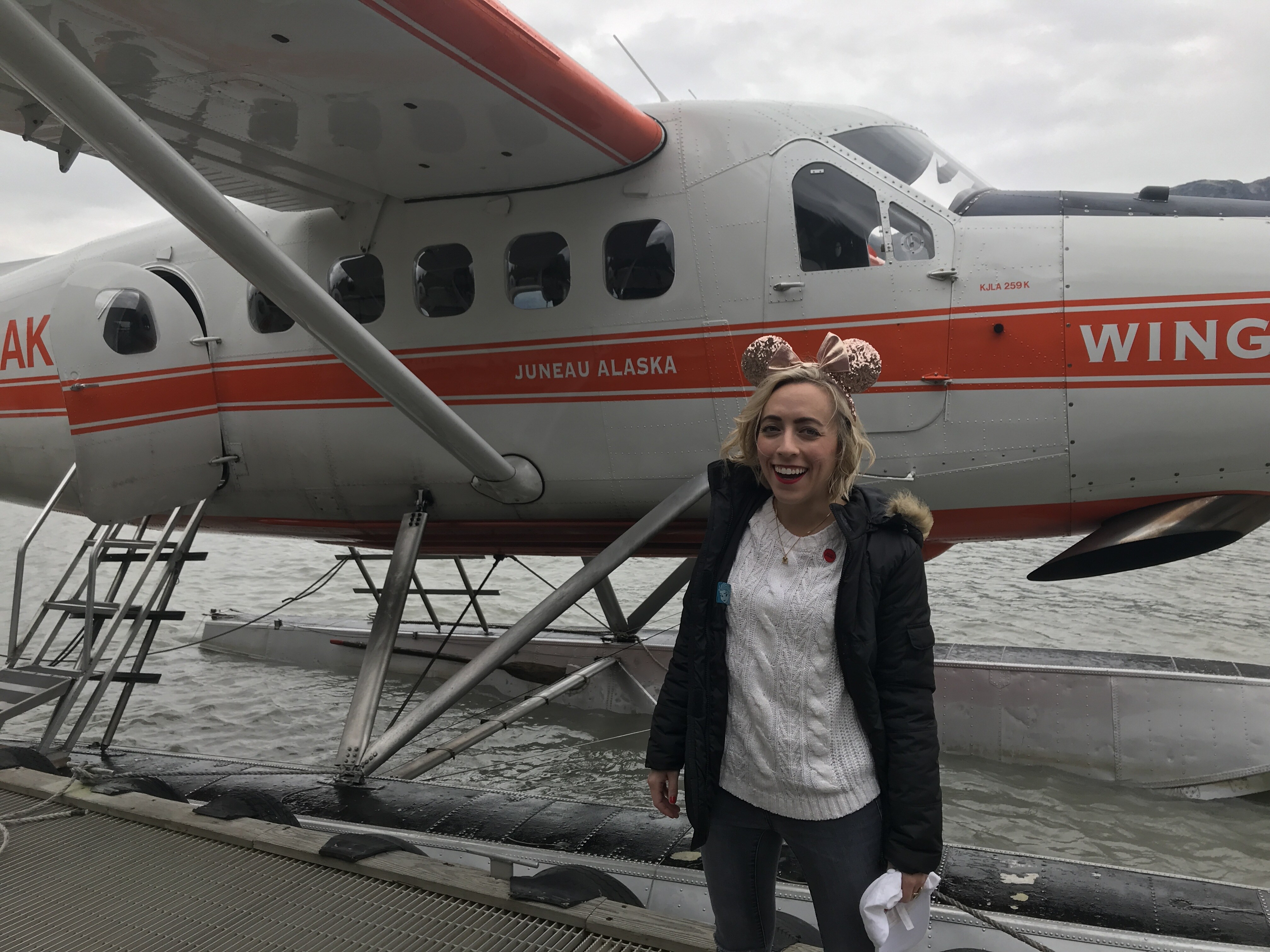 Oh My Disney Host Michelle Lema in front of Seaplane on Taku Glacier Excursion on Disney Wonder Alaska Cruise