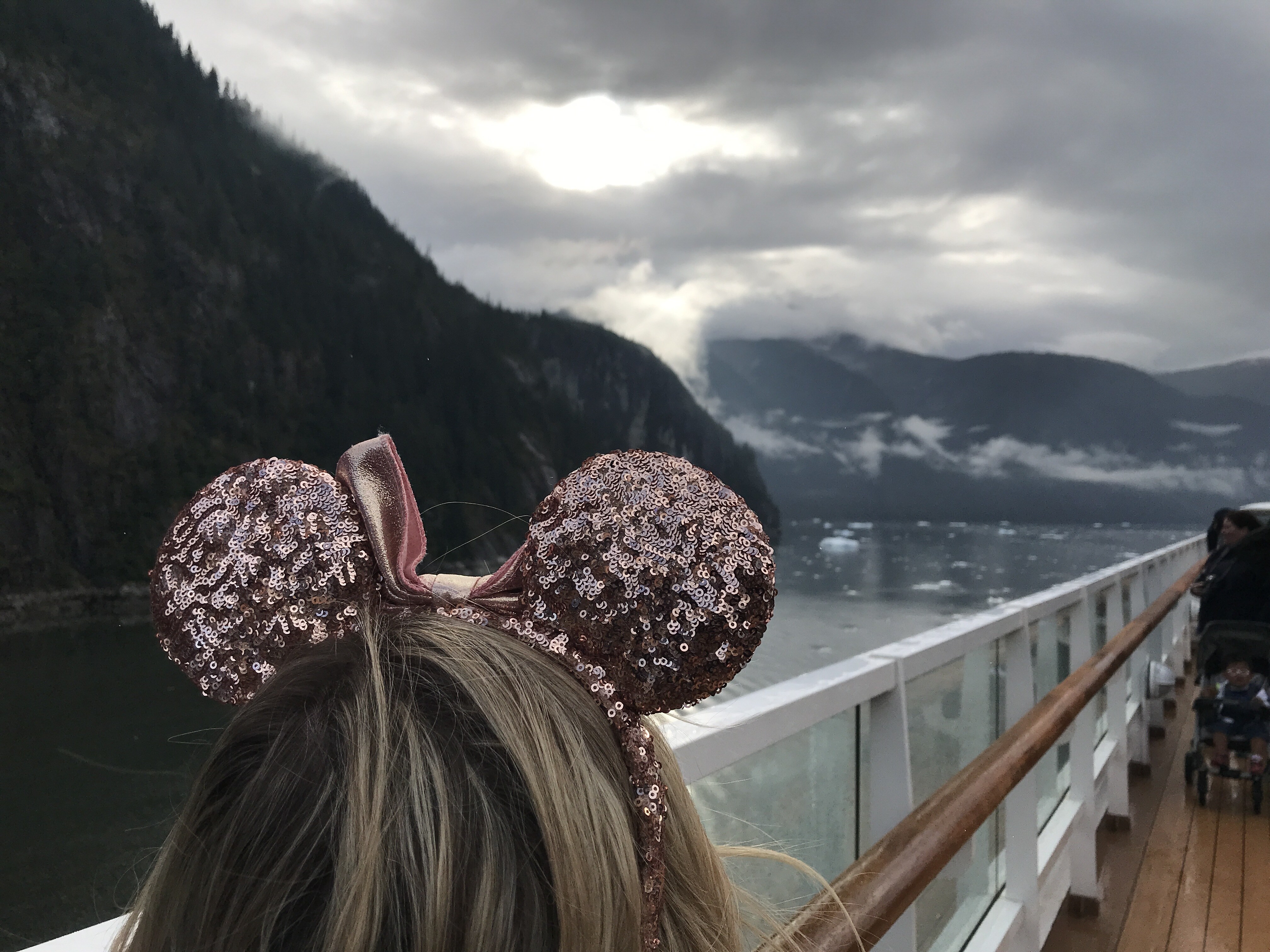 Tracy Arm View Off the Top Deck of the Disney Wonder with Oh My Disney Host wearing Minnie Ears