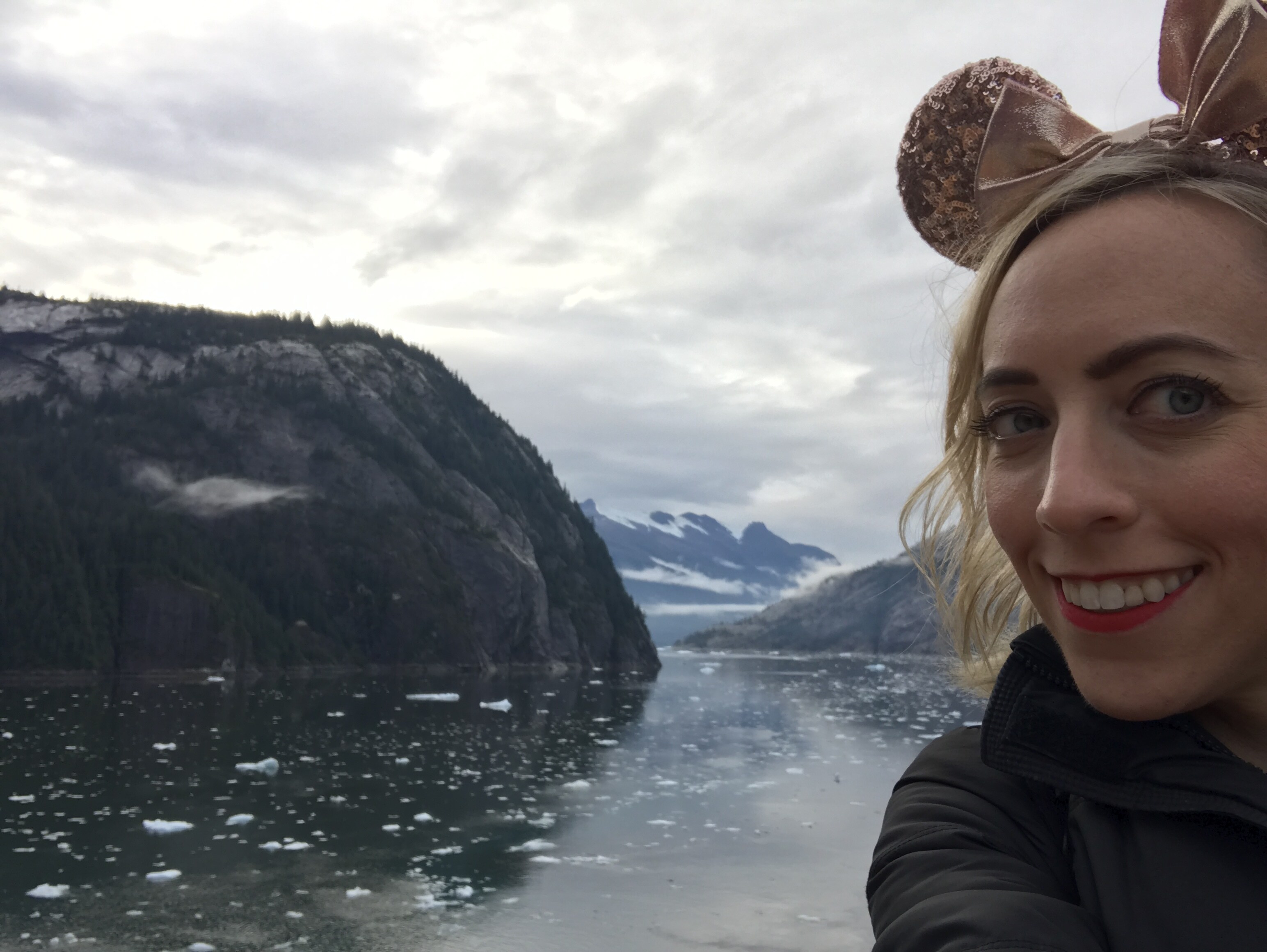 Oh My Disney Host Michelle Lema on Deck in Front of Tracy Arm View From the Disney Wonder Alaska Cruise