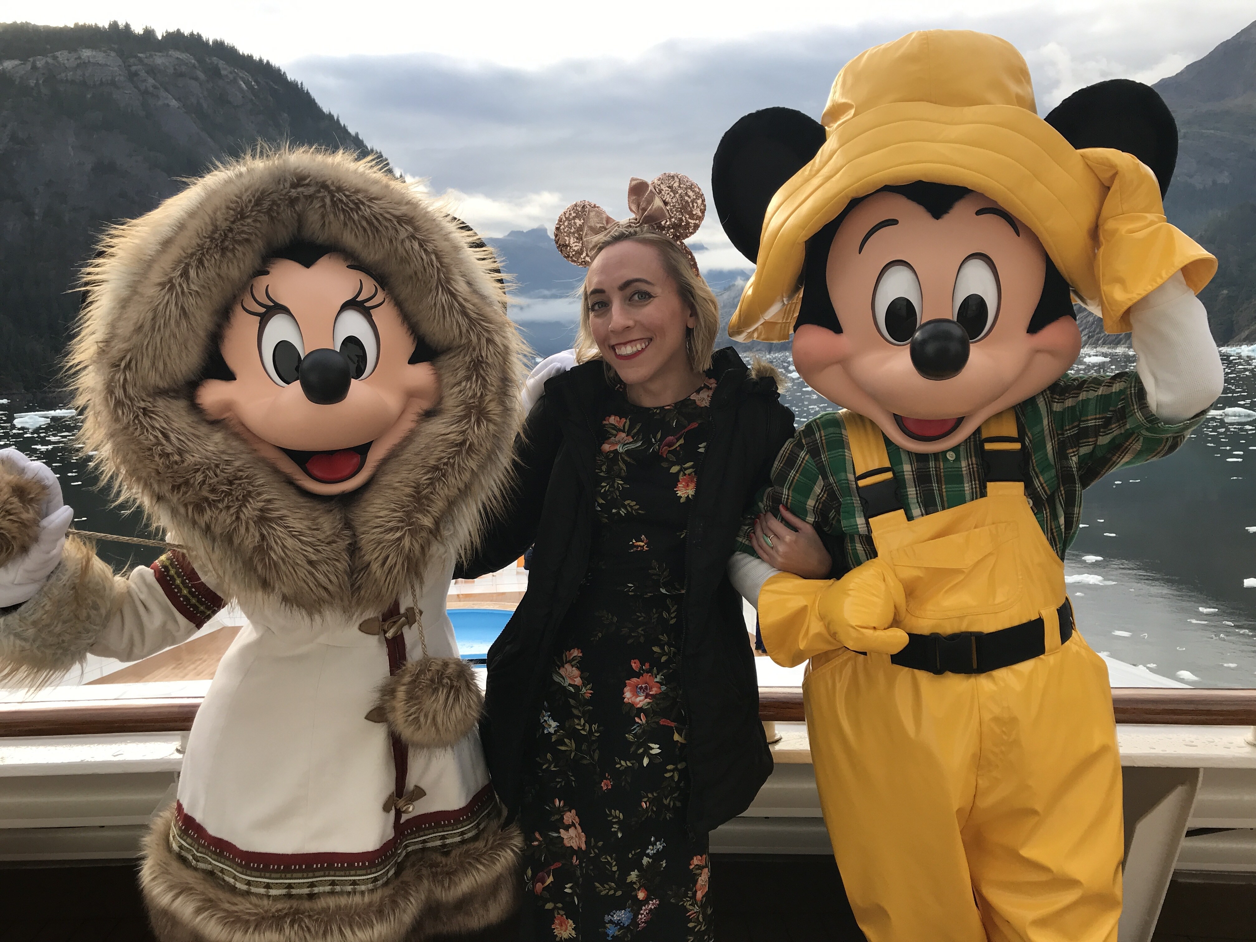 Oh My Disney host Michelle Lema with Mickey Mouse and Minnie Mouse on Disney Wonder Alaska Cruise deck
