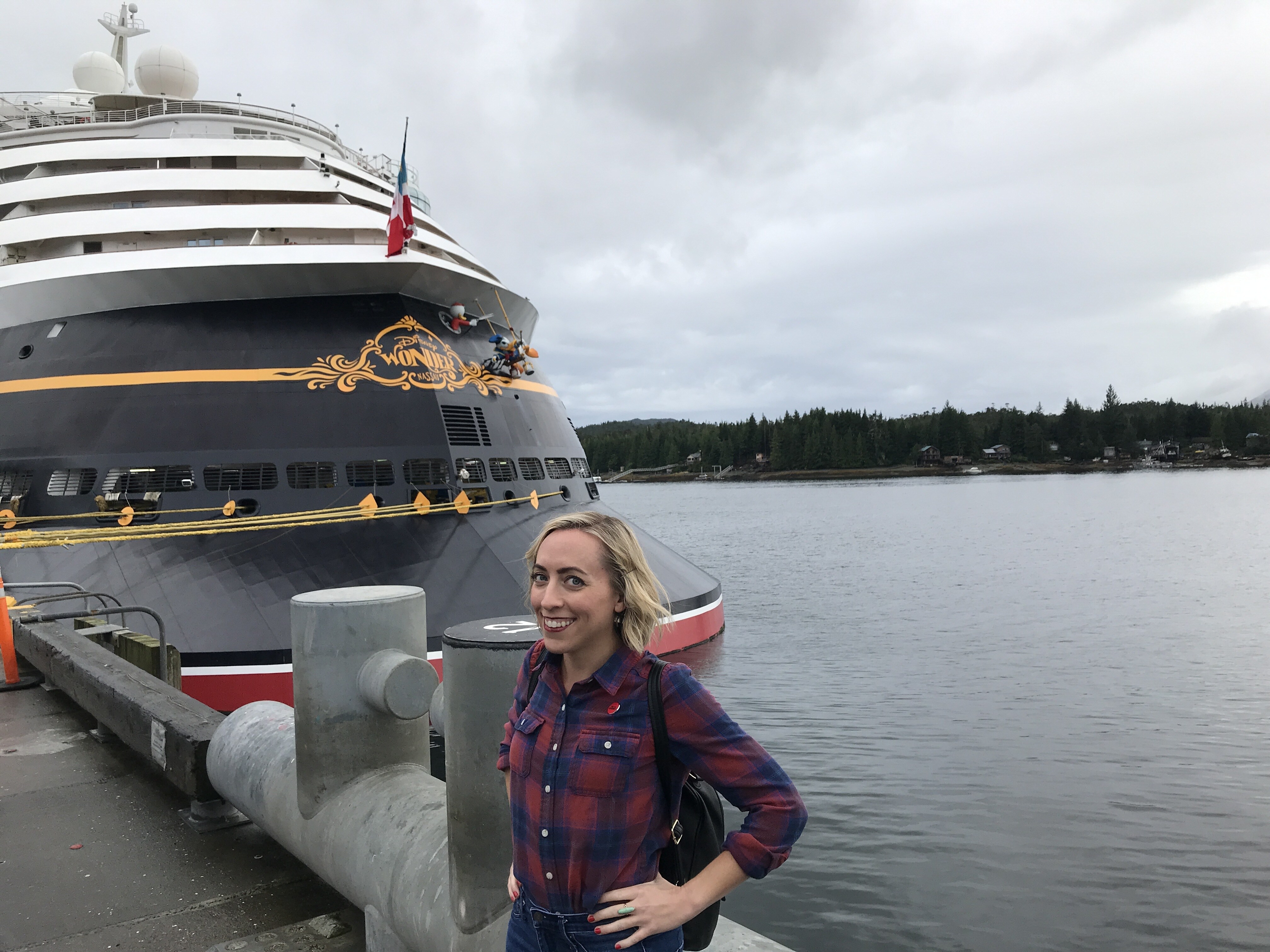 Oh My Disney Host Michelle Lema in front of the Disney Wonder in Ketchikan on the Disney Alaska Cruise