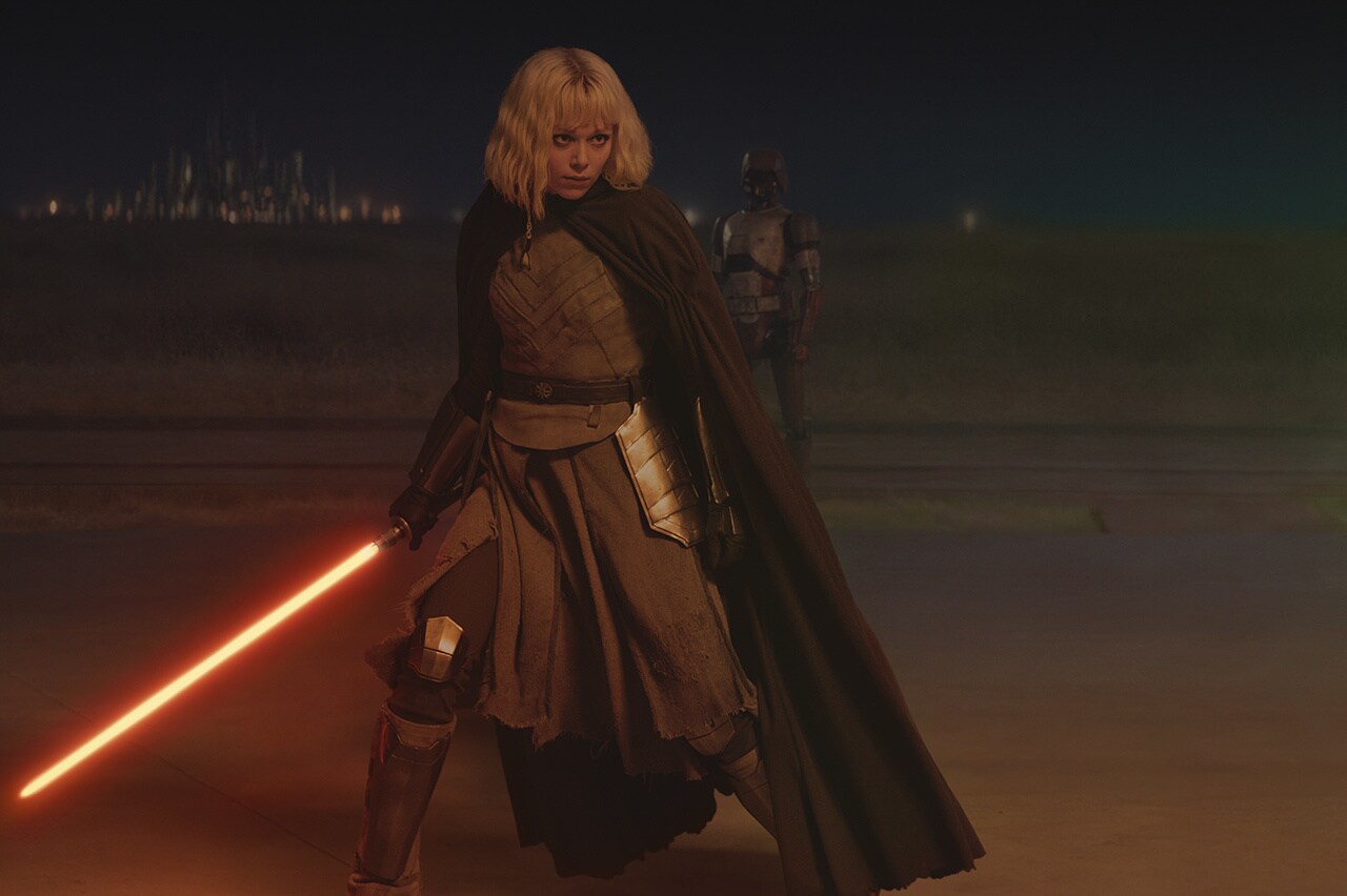 Shin with her lightsaber ignited.