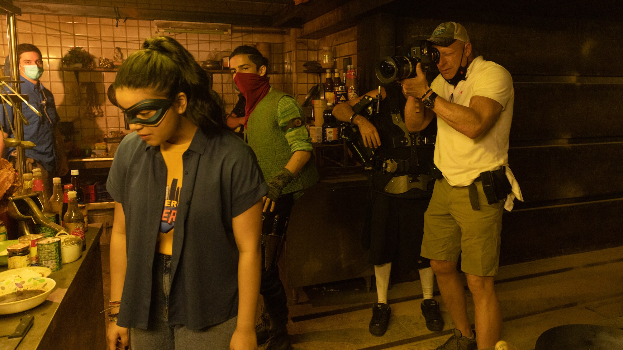 (L-R): Screenwriter Bisha K. Ali and Zenobia Shroff as Muneeba on the set of Marvel Studios' MS. MARVEL. Photo by Patrick Brown. ©Marvel Studios 2022. All Rights Reserved.