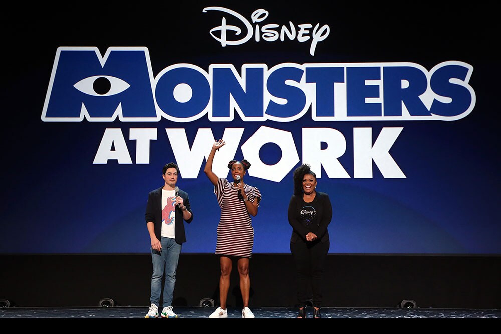 Monsters at Work cast on D23 stage; Ben Feldman, Aisha Tyler, and Yvette Nicole Brown 