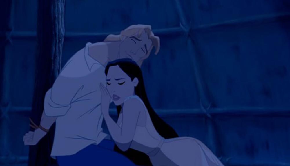 Animated character Pocahontas leaning on captured John Smith from the film "Pocahontas"