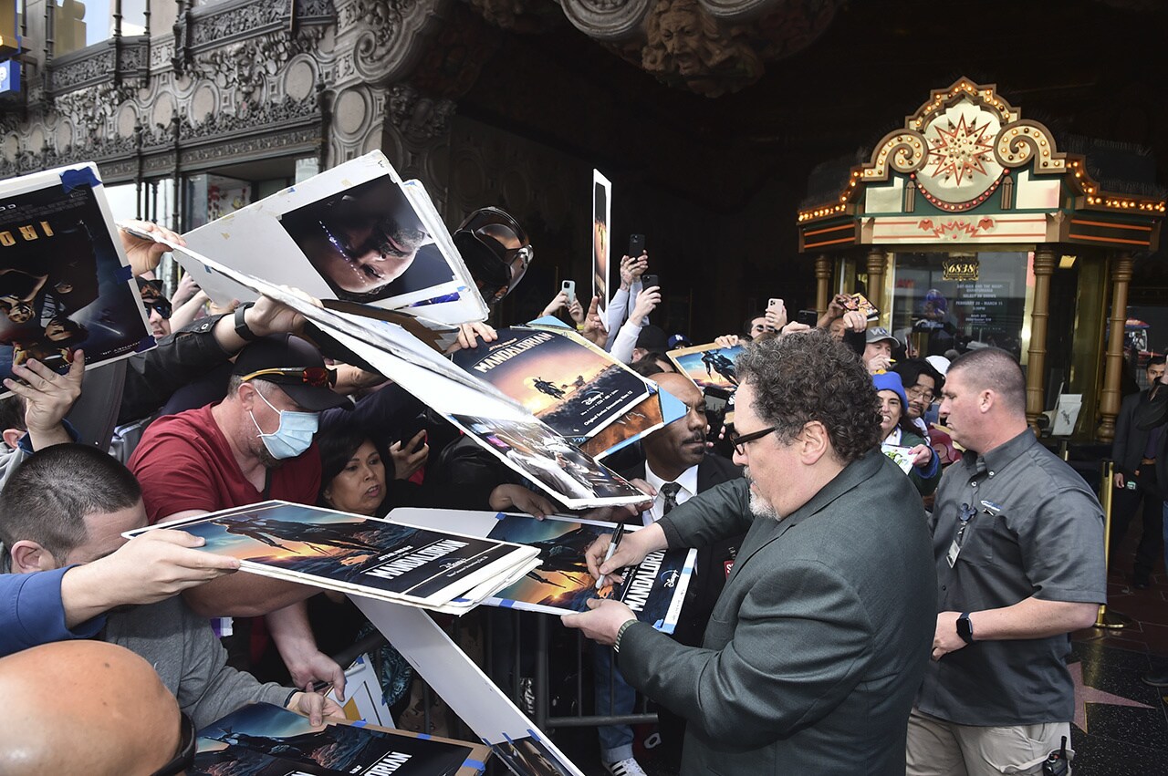 Jon Favreau signing The Mandalorian posters