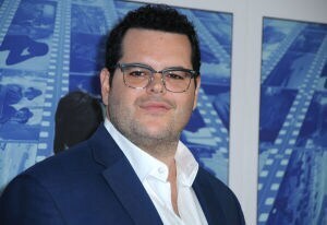 Actor Josh Gad against a blue background. 