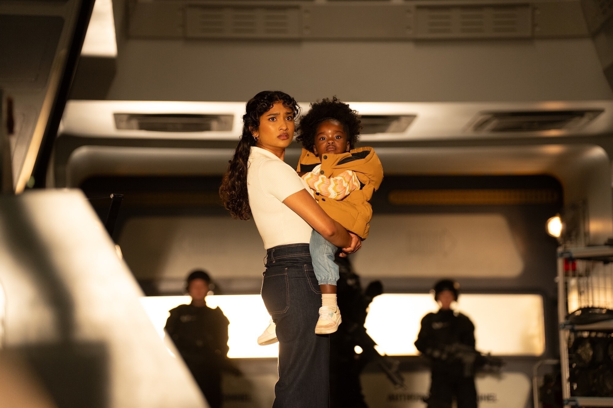 Picture Shows: Belinda Chandra (Varada Sethu) Poppy (Sienna-Robyn Mavanga-Phipps) James Pardon/BBC Studios/Bad Wolf