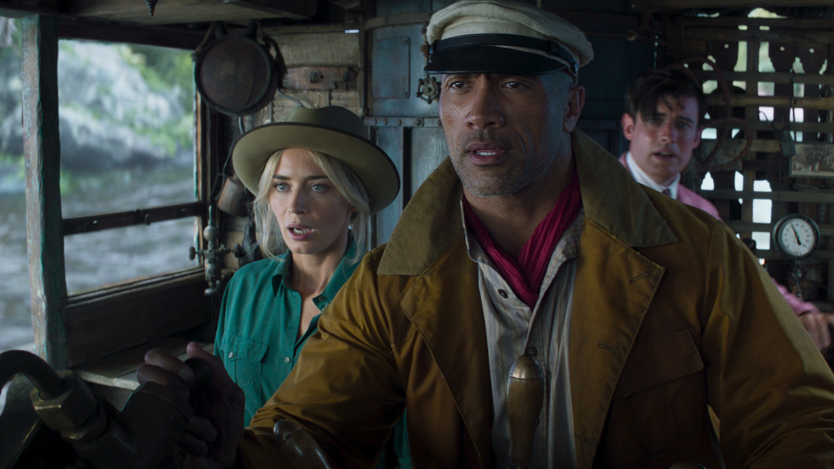 (L-R): Emily Blunt as Lily Houghton, Dwayne Johnson as Frank Wolff and Jack Whitehall as MacGregor Houghton in Disney’s JUNGLE CRUISE. Photo courtesy of Disney. © 2021 Disney Enterprises, Inc. All Rights Reserved.