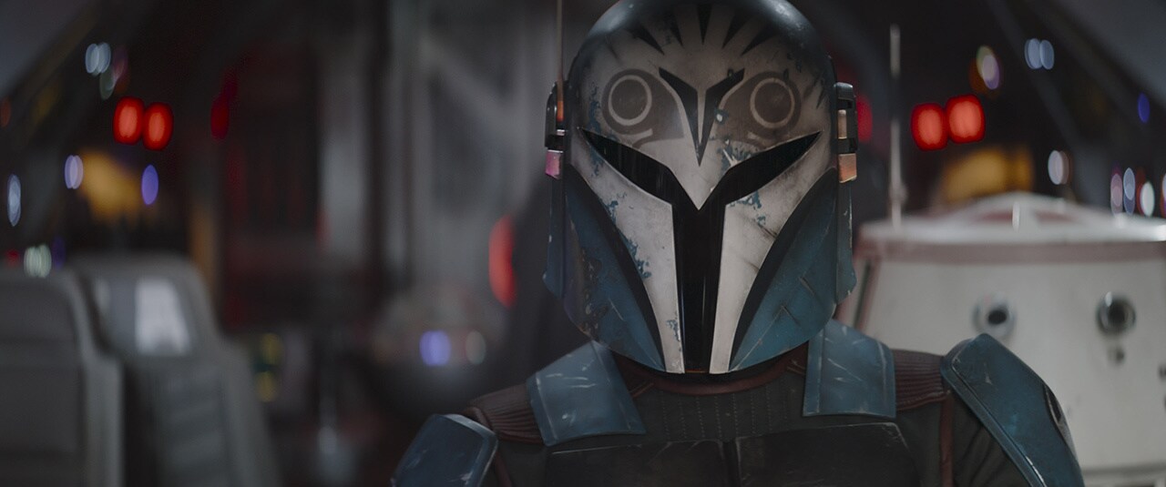 A close up of Bo-Katan with her helmet on